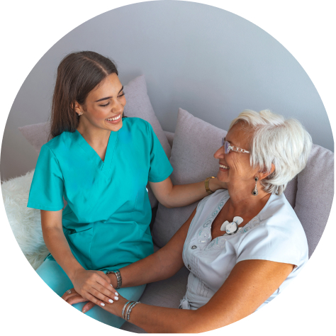 A female doctor sits with a patient using a chest monitor